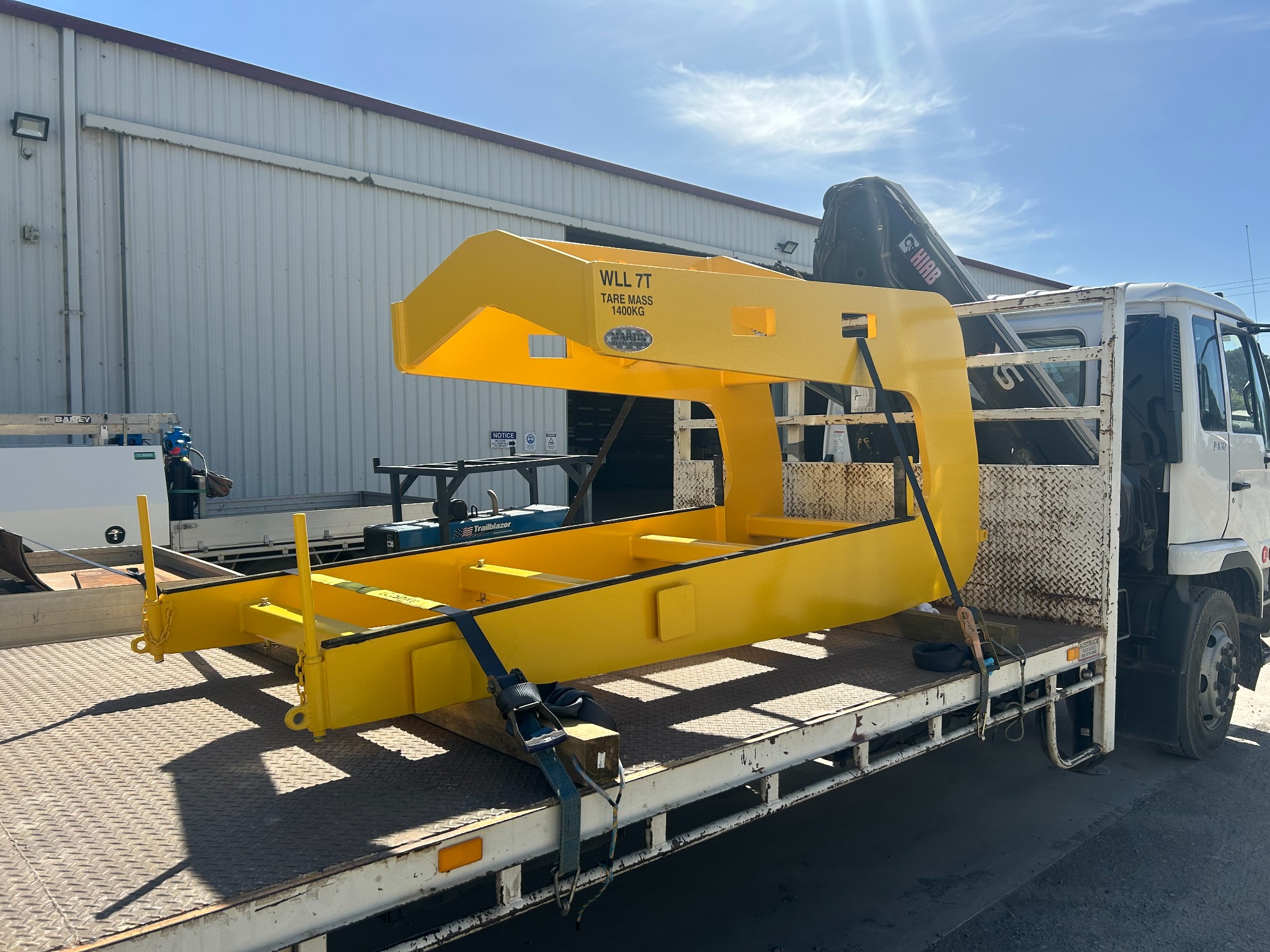 Custom yellow lifting frame fabricated by Varotek